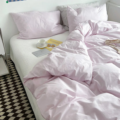 Soft pastel solid washed cotton duvet cover and pillowcases in a cozy minimalist bedroom – RoomDen