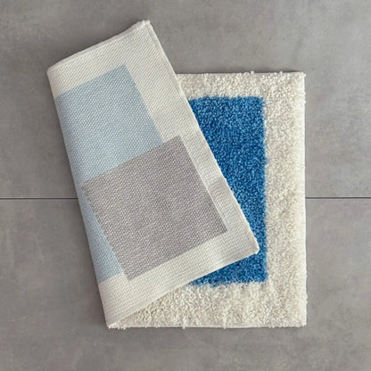 Folded Modern Color Block Plush Accent Rug showing the white non-slip TPR backing and thick tufted pile - RoomDen