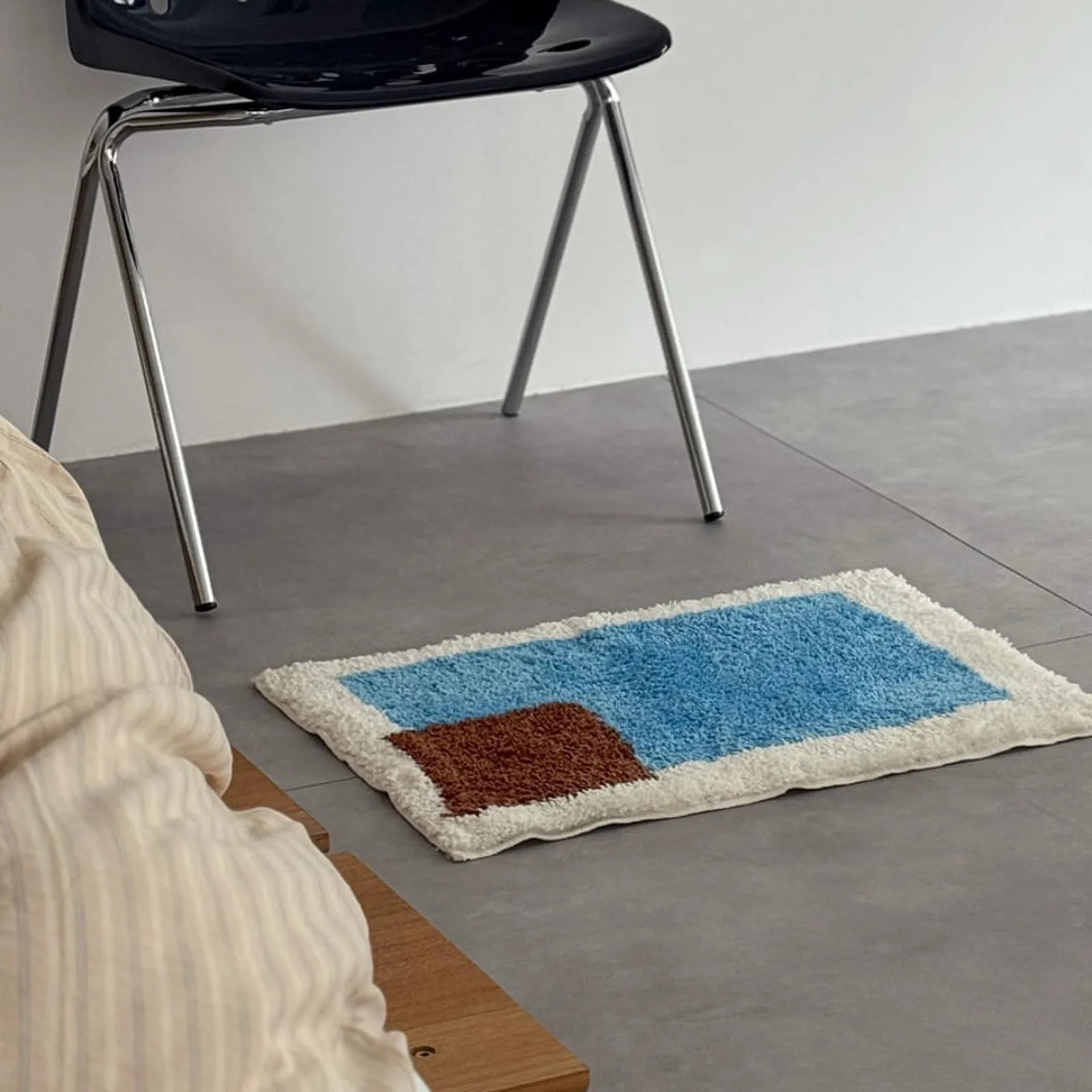 Side angle view of Modern Color Block Plush Accent Rug on the floor emphasizing the soft texture and color contrast - RoomDen
