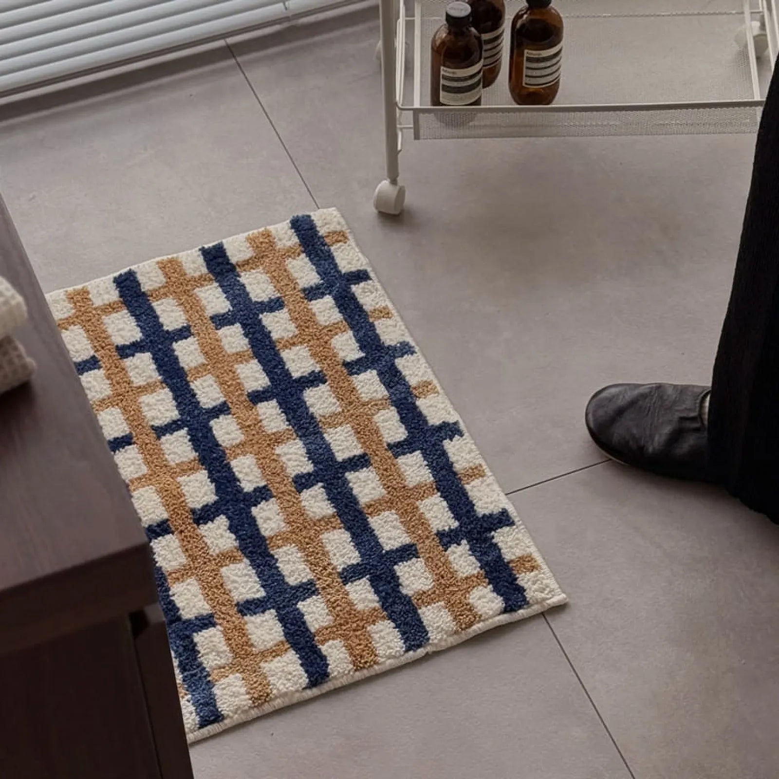 High-angle view of the rug in a bedroom setting with metal side table - RoomDen