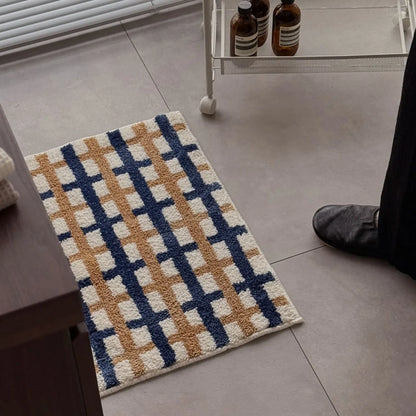 High-angle view of the rug in a bedroom setting with metal side table - RoomDen