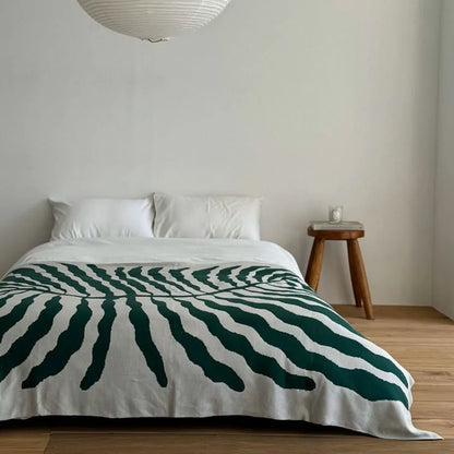 Leaf pattern flannel fleece throw blanket in a modern cozy home setting – RoomDen