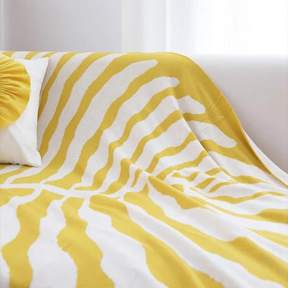 Leaf pattern flannel fleece throw blanket in a modern cozy home setting – RoomDen