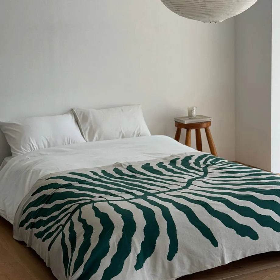 Leaf pattern flannel fleece throw blanket in a modern cozy home setting – RoomDen