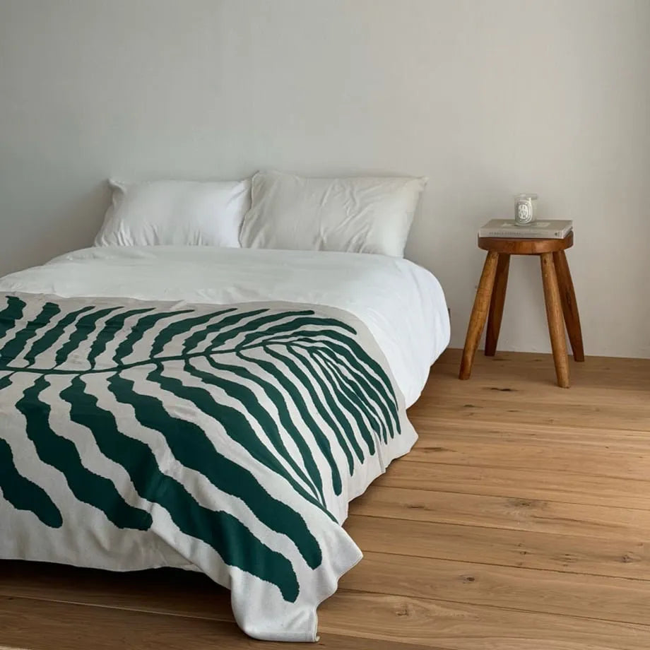 Leaf pattern flannel fleece throw blanket in a modern cozy home setting – RoomDen