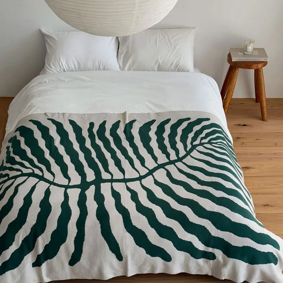 Leaf pattern flannel fleece throw blanket in a modern cozy home setting – RoomDen