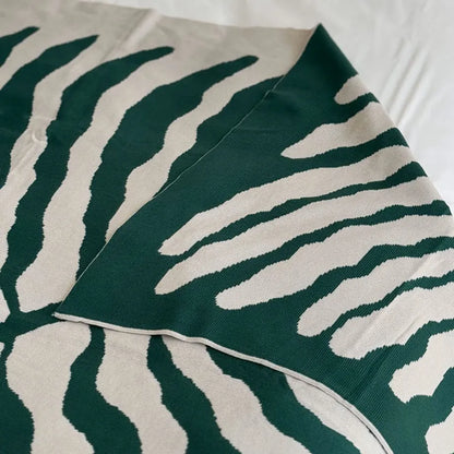Leaf pattern flannel fleece throw blanket in a modern cozy home setting – RoomDen