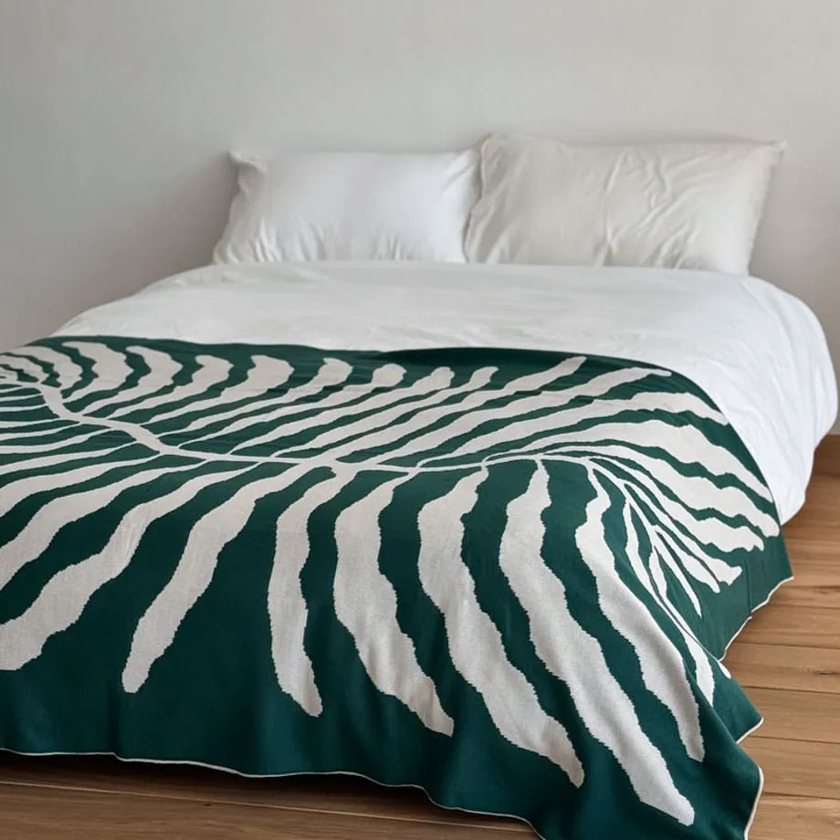 Leaf pattern flannel fleece throw blanket in a modern cozy home setting – RoomDen