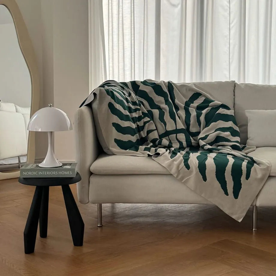 Leaf pattern flannel fleece throw blanket in a modern cozy home setting – RoomDen