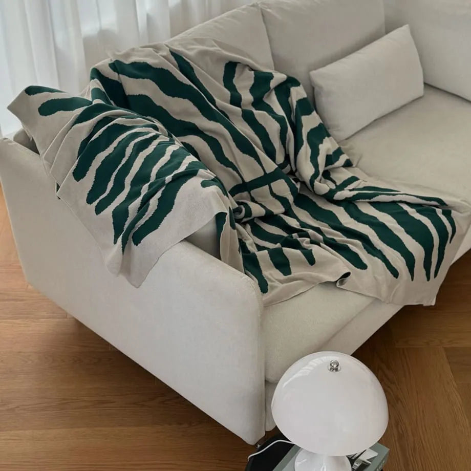 Leaf pattern flannel fleece throw blanket in a modern cozy home setting – RoomDen