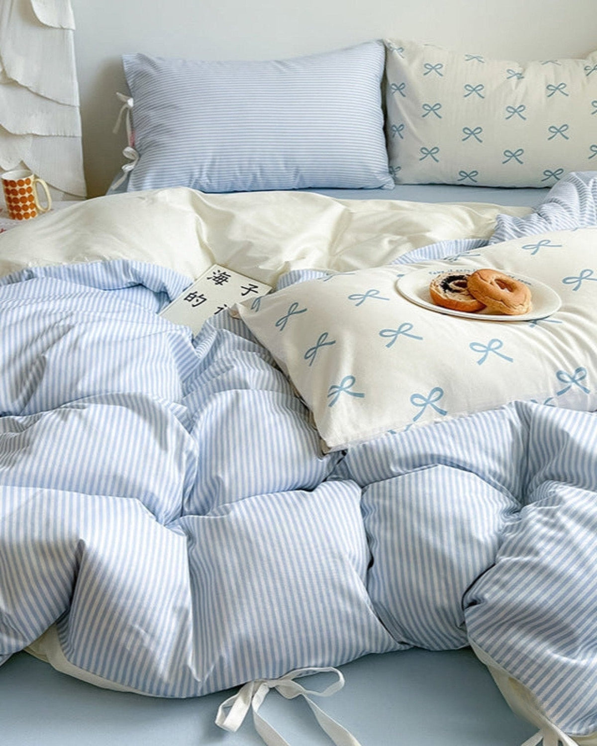 Bow striped cotton bedding set – Powder Blue, coordinated duvet and pillow view - Roomden
