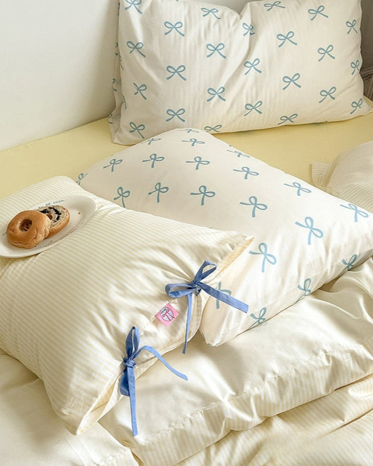 Bow striped cotton bedding set – Butter Yellow, striped fabric, ribbon ties and pillow detail - Roomden