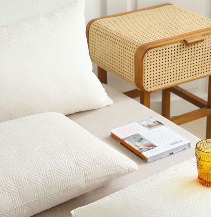 Stack of cream quilted pillow inserts showing soft texture and plush fullness - RoomDen 