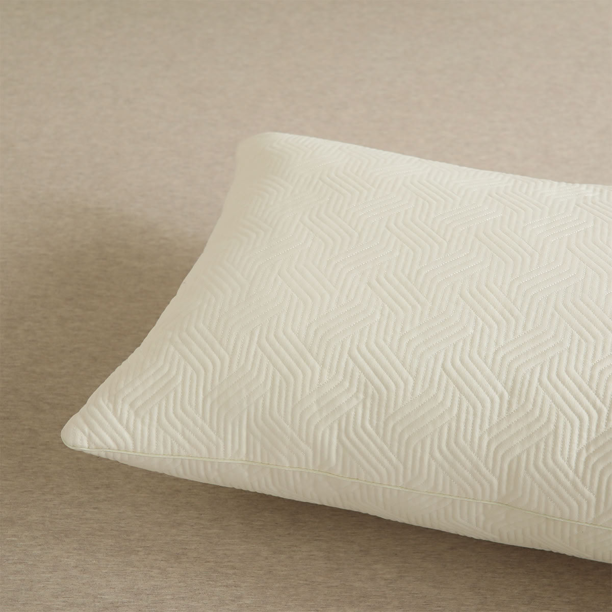 Close-up of flat edge pillow insert with geometric quilting pattern - RoomDen
