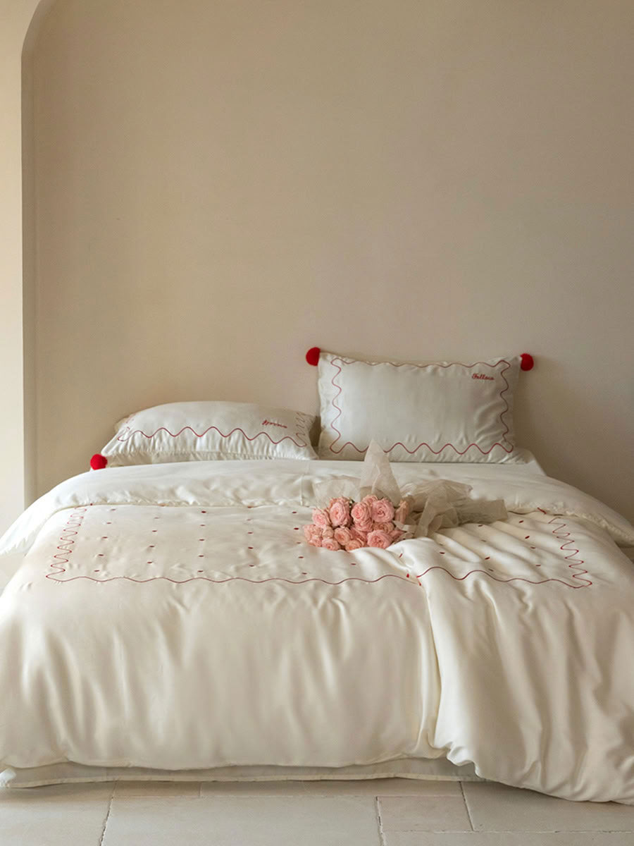 Cream white Tencel bedding with red dot and ripple details, bright minimalist bedroom - RoomDen