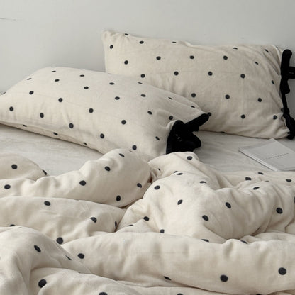 Aesthetic bedroom shot with cream and black polka dot fleece bedding RoomDen