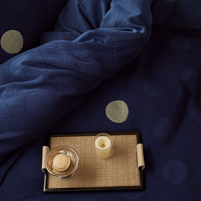 Detail of deep blue waffle cotton fabric with light beige polka dots – RoomDen