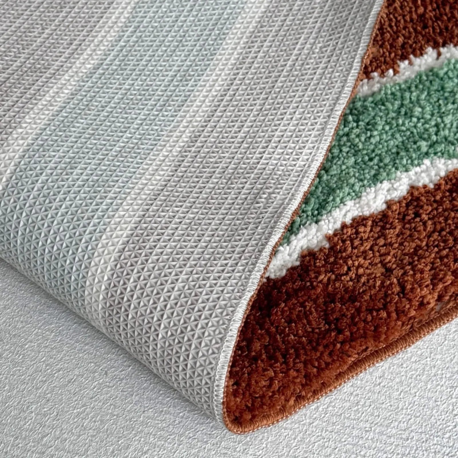 Back view of the rug revealing the anti-slip TPR backing texture.