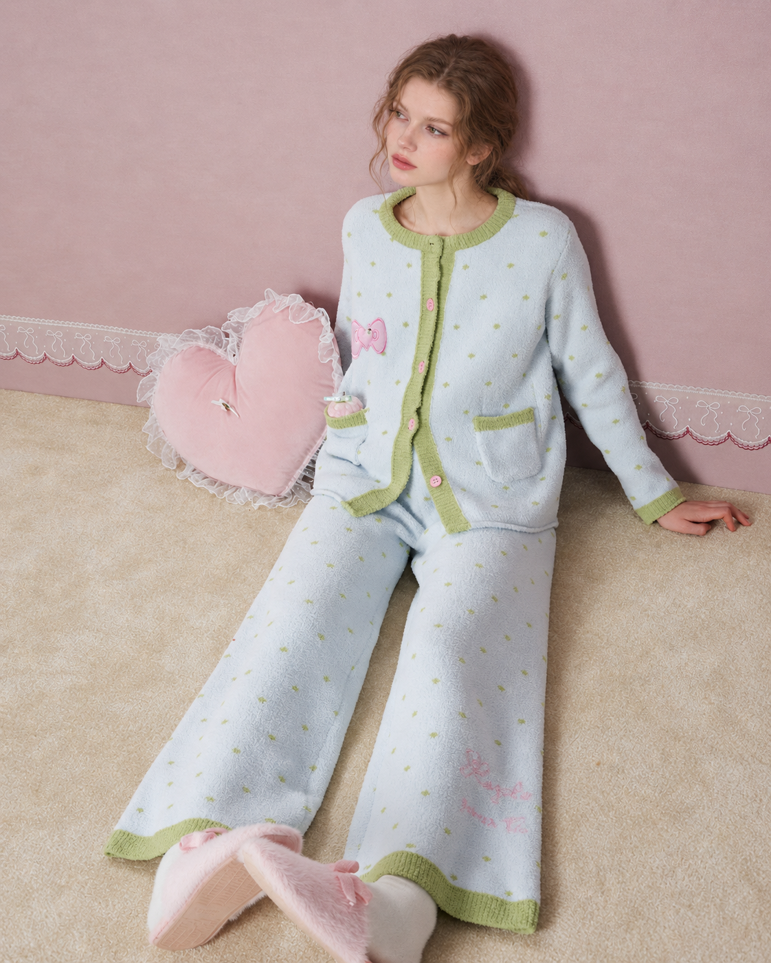Fleece Three-Piece Pajama Set – Ice blue full seated view with a heart cushion beside the model - Roomden