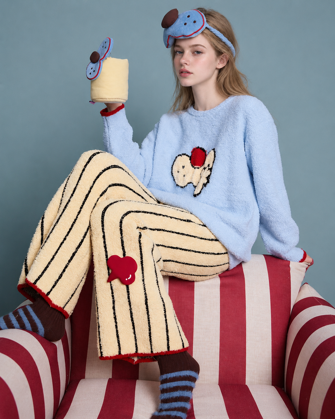Cat Motif Plush Pajama Set – side seated view showing striped pants and red edging - Roomden