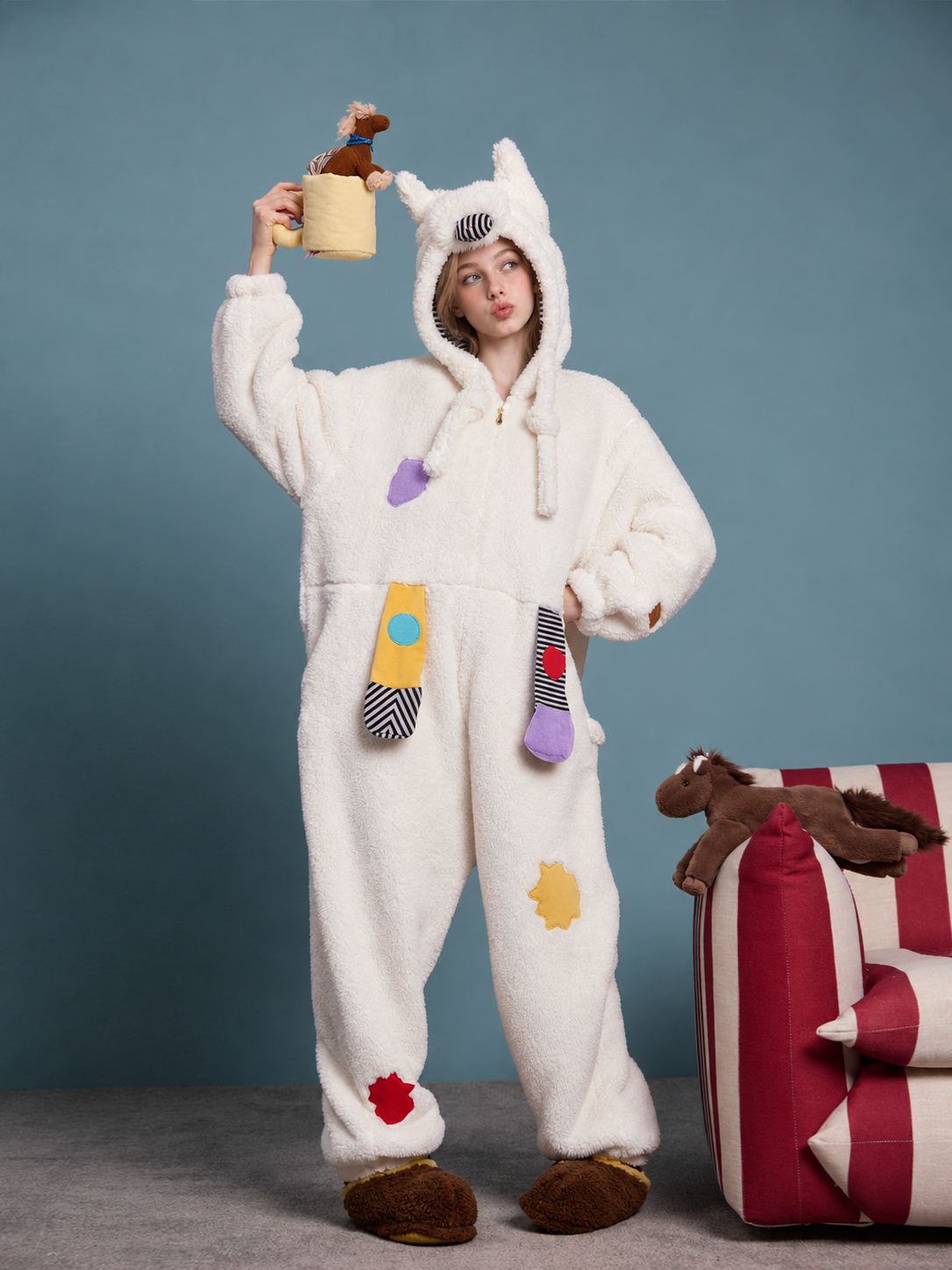 Pony Hood Fleece One-Piece Pajamas – milk-white front view holding a pony toy - Roomden
