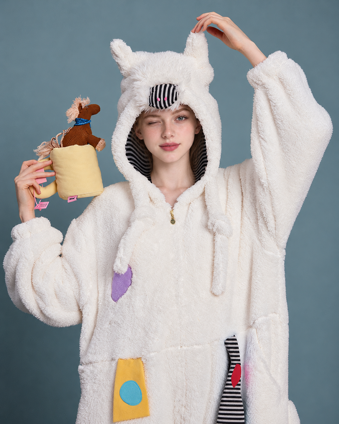 Pony Hood Fleece One-Piece Pajamas – hood and striped nose close view holding a toy - Roomden