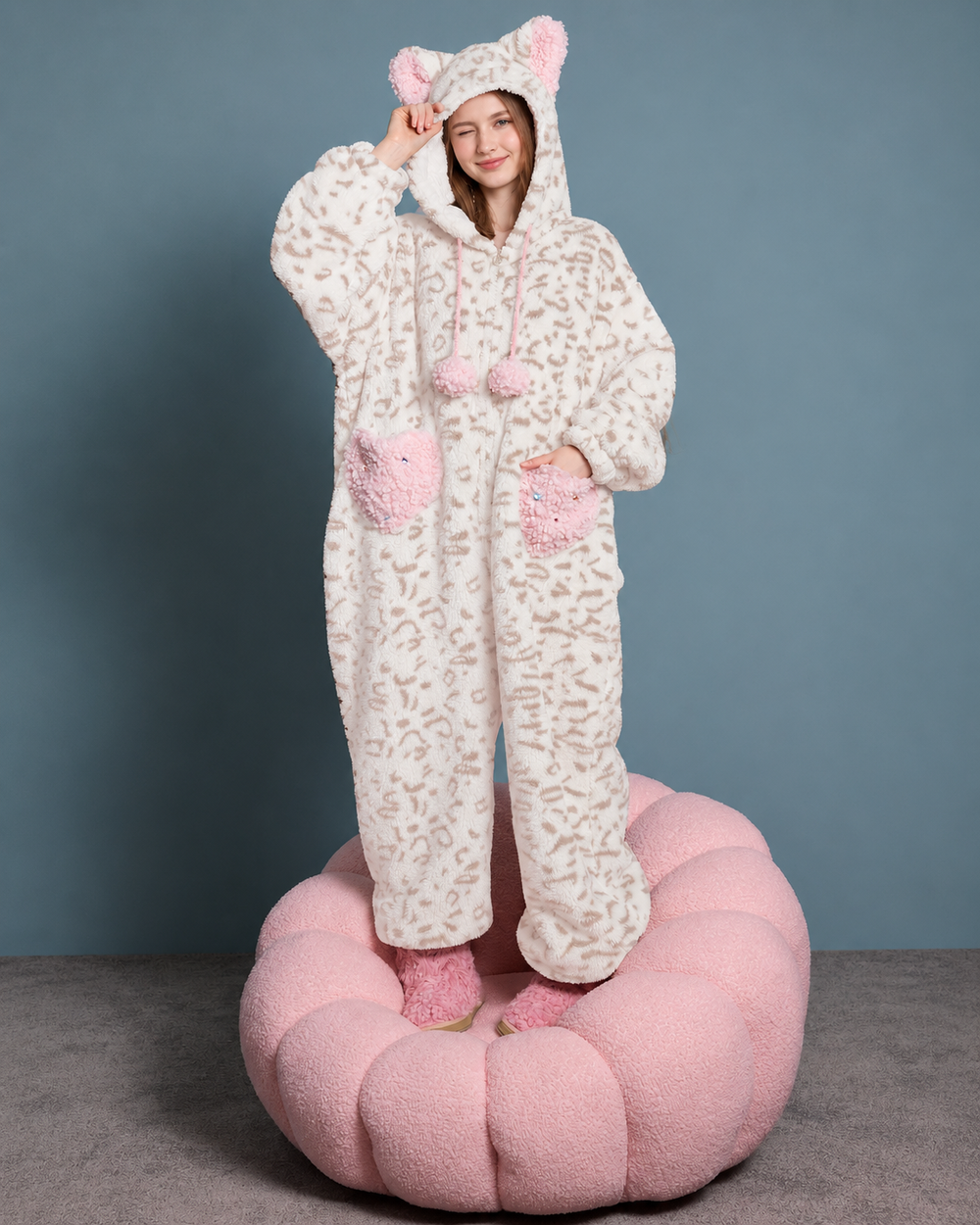 Cat-Ear Leopard Fleece One-Piece Pajamas – cream and pink full front view standing on a pink chair - Roomden