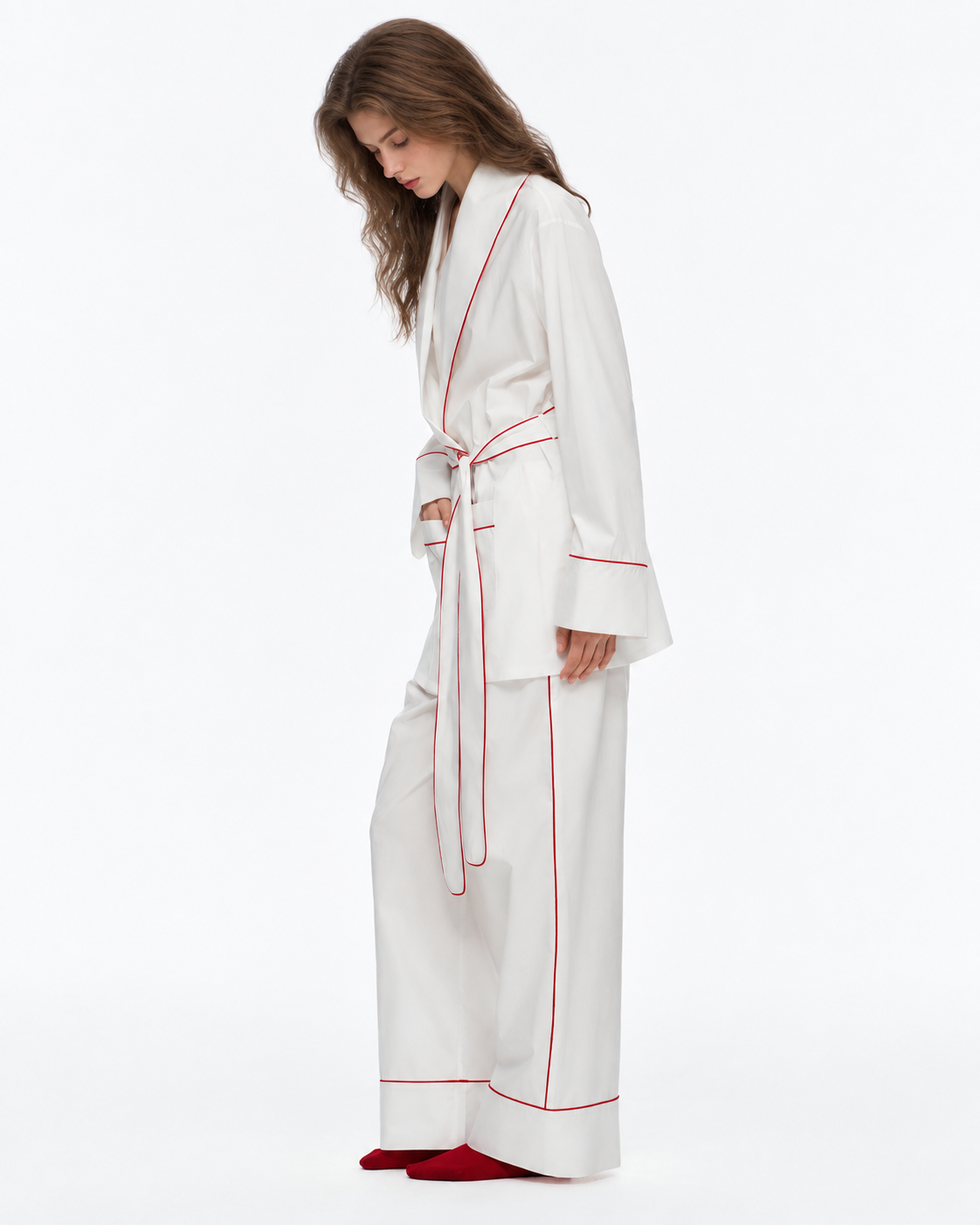Linehaven wrap pajama set – Milky White, side-standing pose with a hand in a pocket in the studio - Roomden