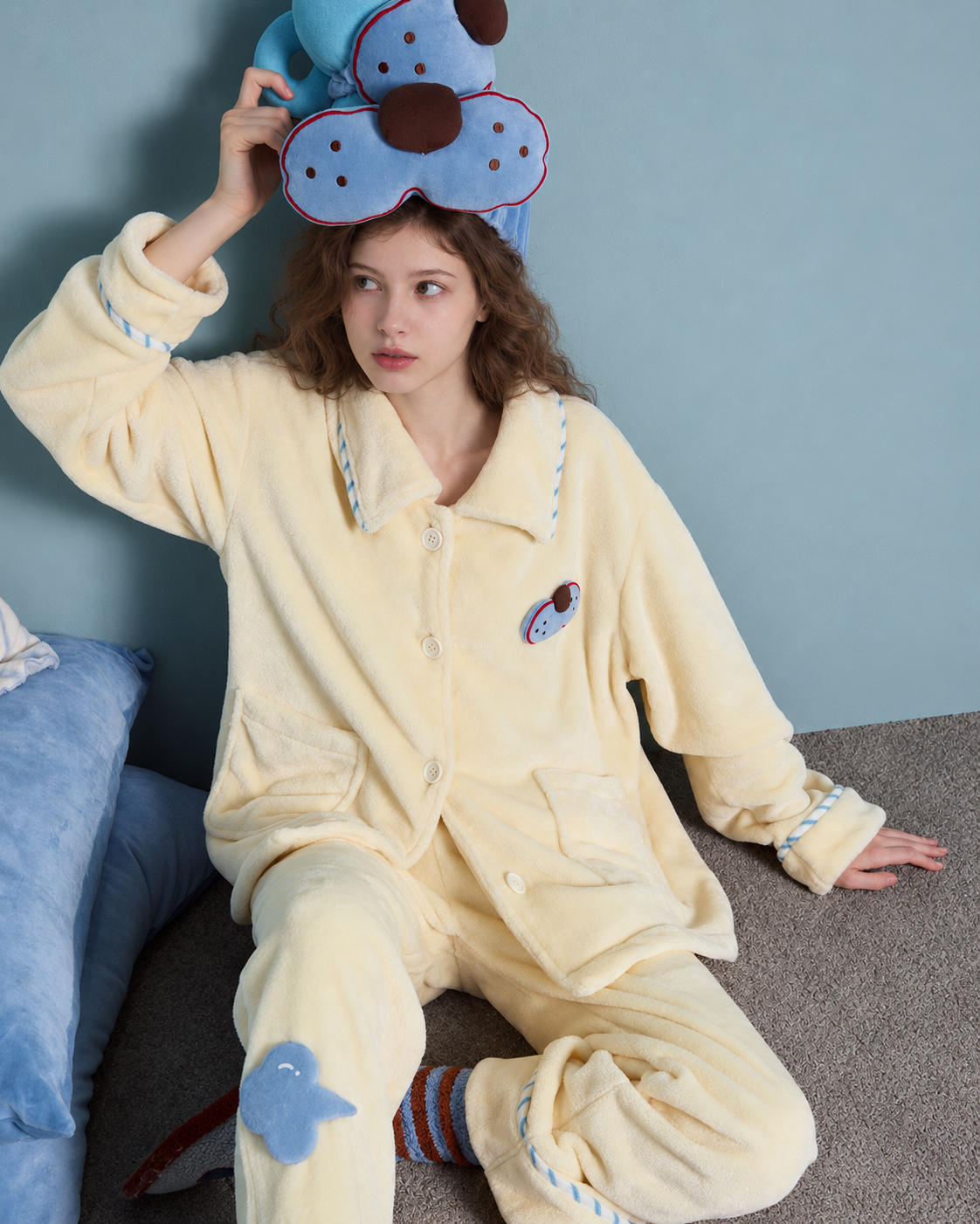Cat Patch Fleece Pajama Set – cream yellow, cross-legged view showing the trouser motif - Roomden