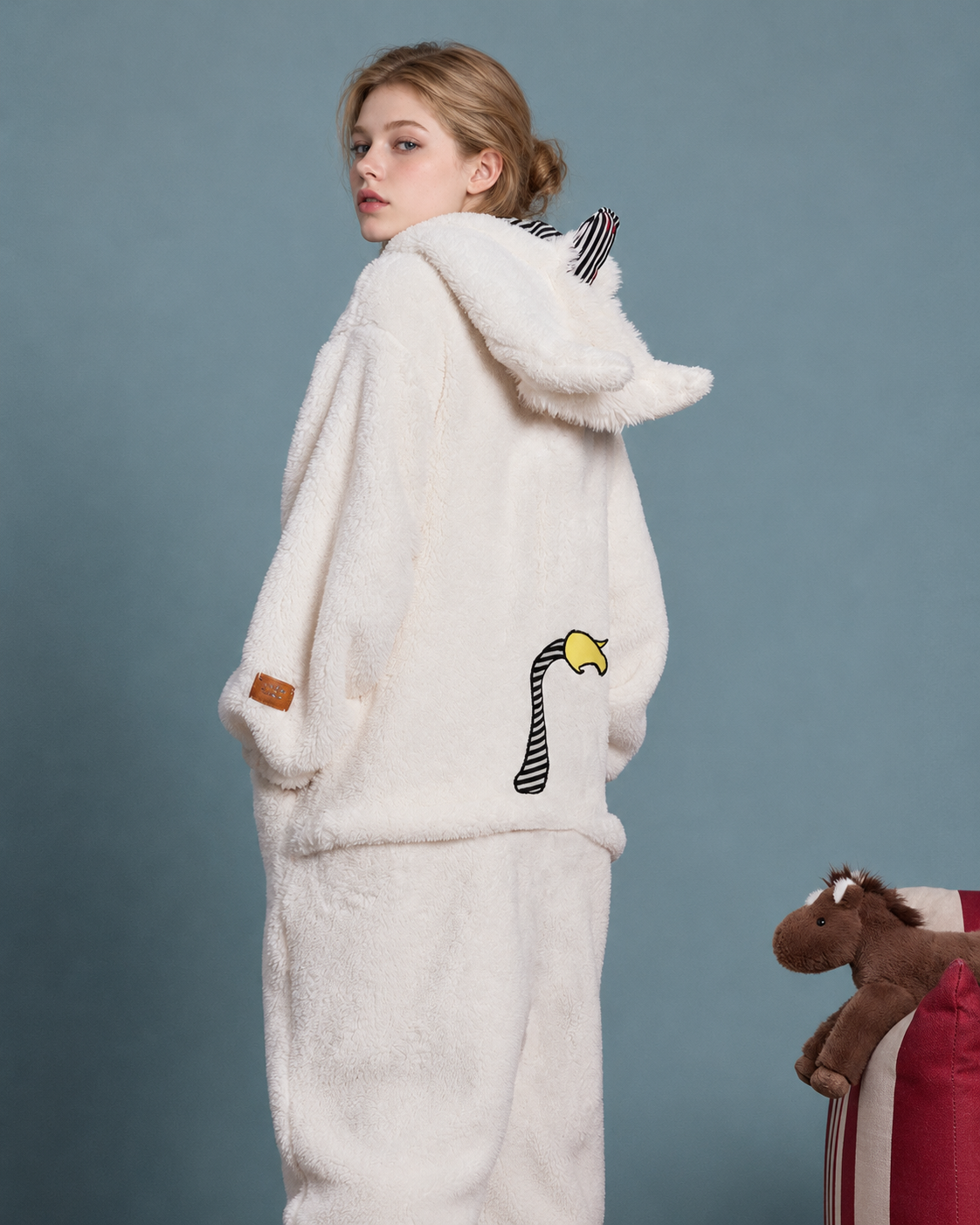 Pony Hood Fleece One-Piece Pajamas – rear side view showing the hood and tail appliqué - Roomden