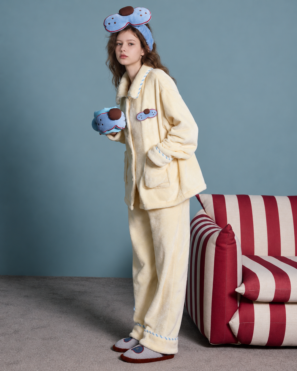 Cat Patch Fleece Pajama Set – cream yellow, three-quarter standing view beside a striped chair - Roomden