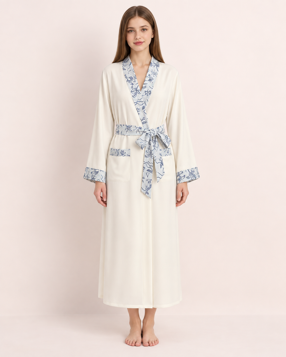 Apricot-cream Inkshore robe with blue botanical trim — studio view 1