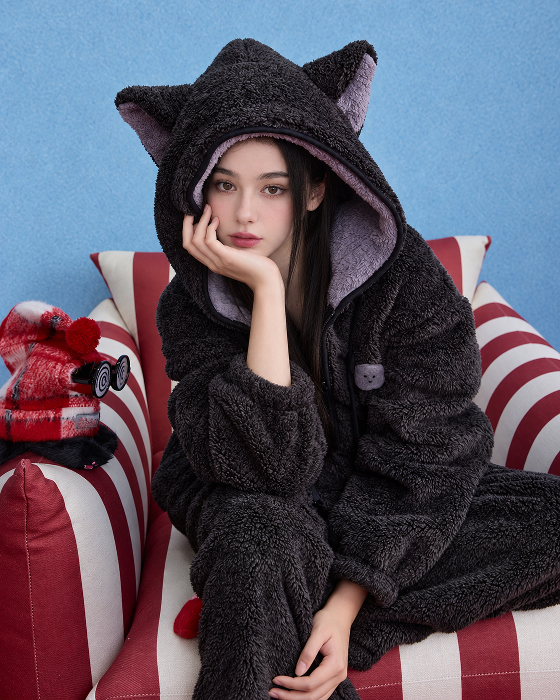 Dark gray cat-ear hooded fleece pajama set, female seated front view - Roomden