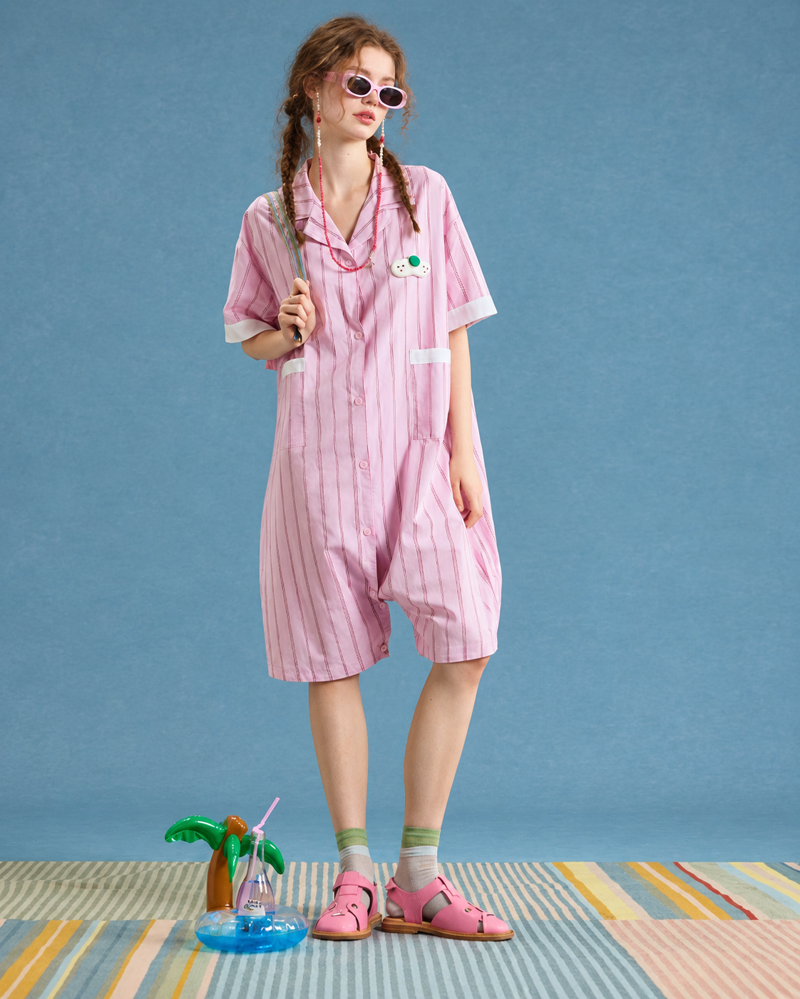 Striped cotton one-piece pajamas – pink full front view with collar and patch pockets - Roomden