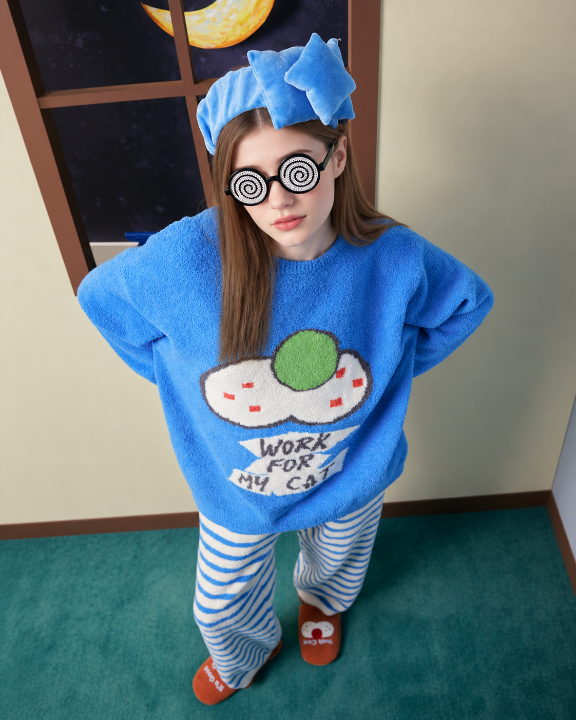 Blue cat graphic fleece pajama set with cream striped pants – Overhead view with novelty glasses