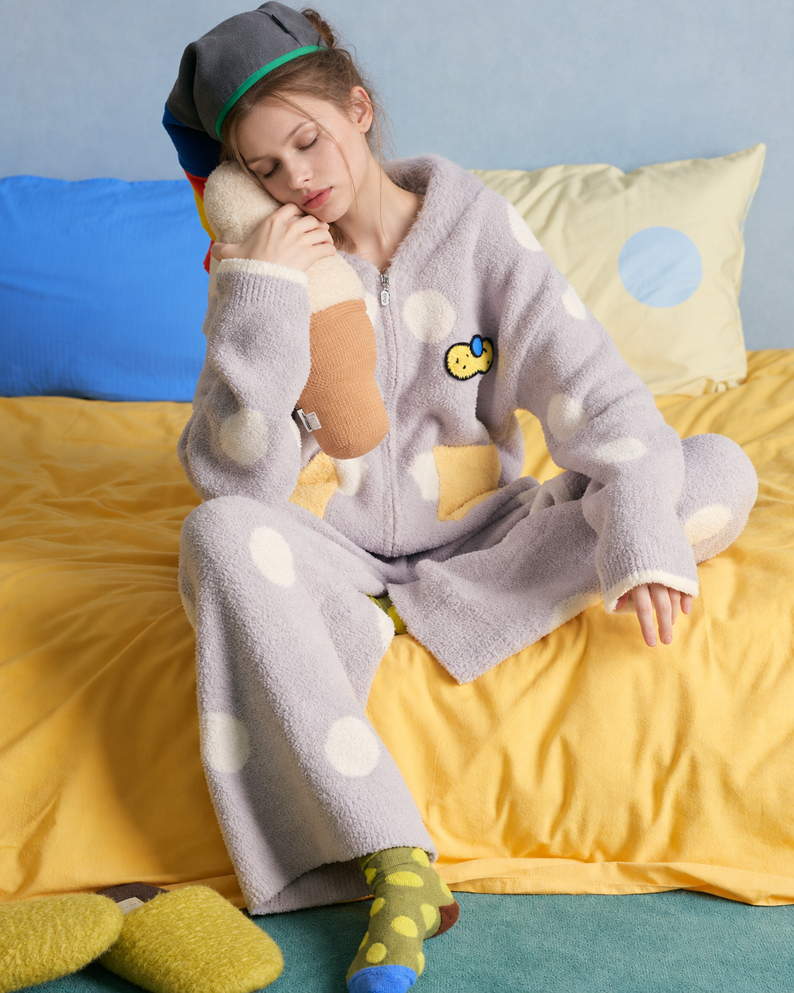 Polka Dot Fleece Pajama Set – light gray long-sleeved set seated on a yellow sofa - Roomden