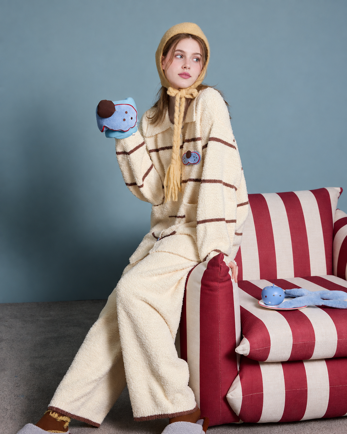 Striped Cat Fleece Pajama Set – cream yellow set seated on a striped armchair - Roomden
