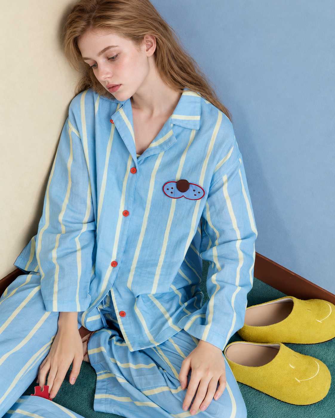 Striped Cotton Pajama Set – blue, yellow and white side seated view of the striped shirt - Roomden