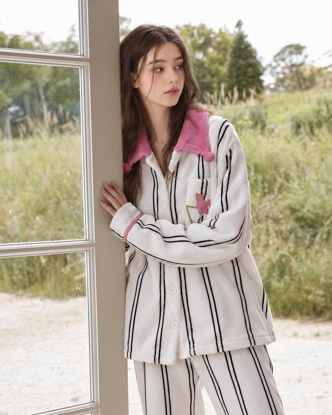 Pink-Collar Striped Fleece Pajama Set – three-quarter front view by a window – Roomden