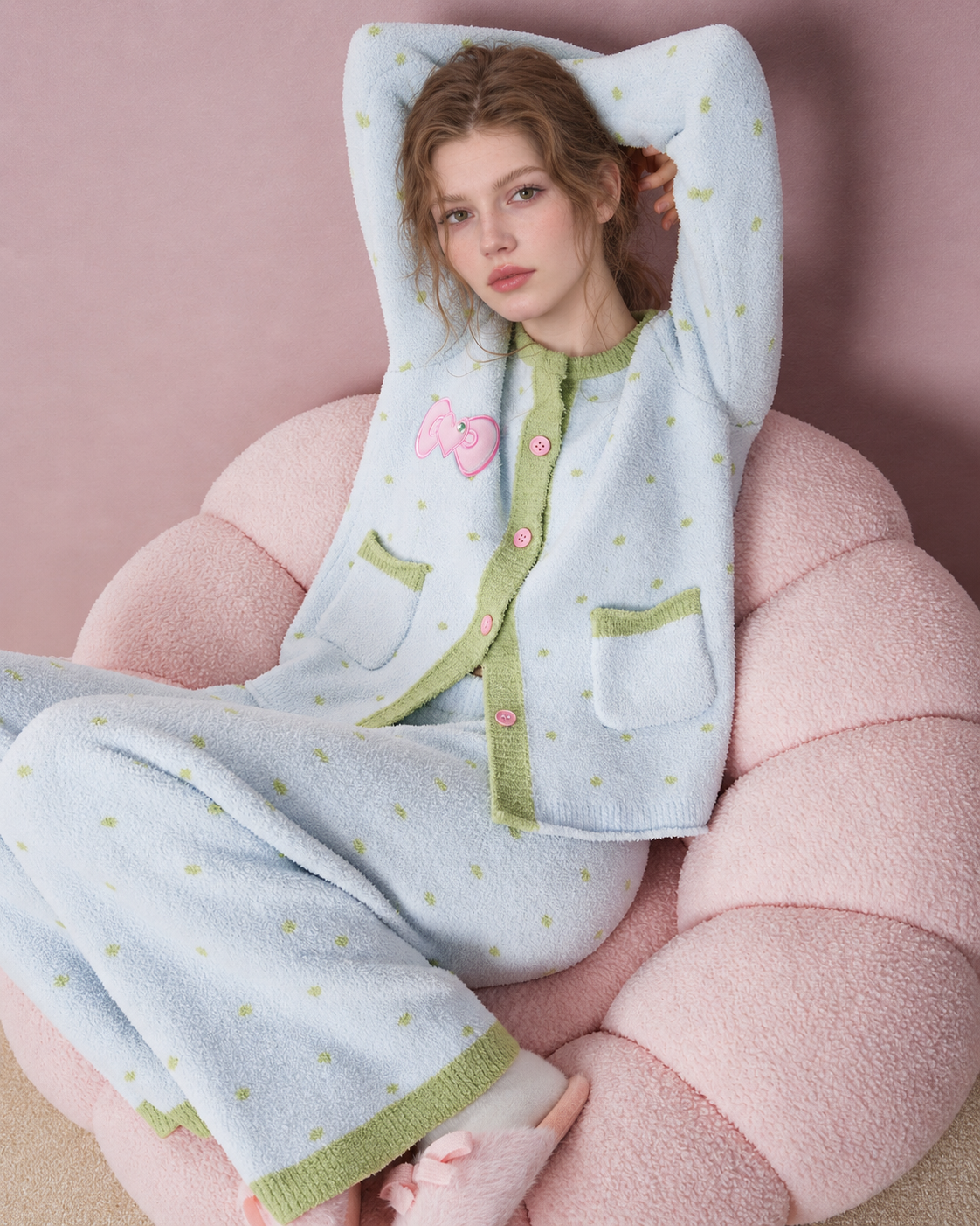 Fleece Three-Piece Pajama Set – Ice blue raised-arm seated view in a pink chair - Roomden