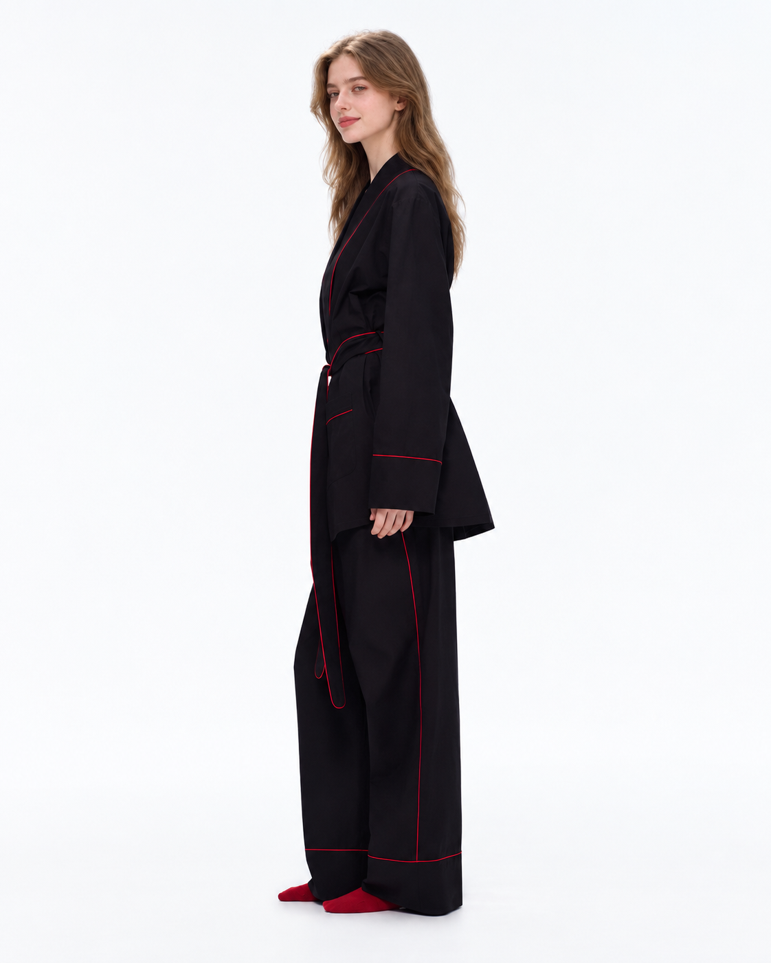 Linehaven wrap pajama set – Classic Black, side view looking back in the studio - Roomden