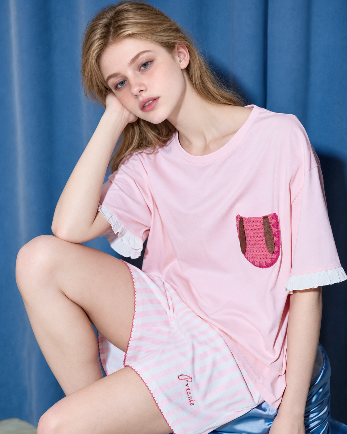 Flopnote Pink Rabbit-Pocket Cotton Pajama Set – hand-on-cheek close view of the sleeve ruffles and crochet pocket - Roomden