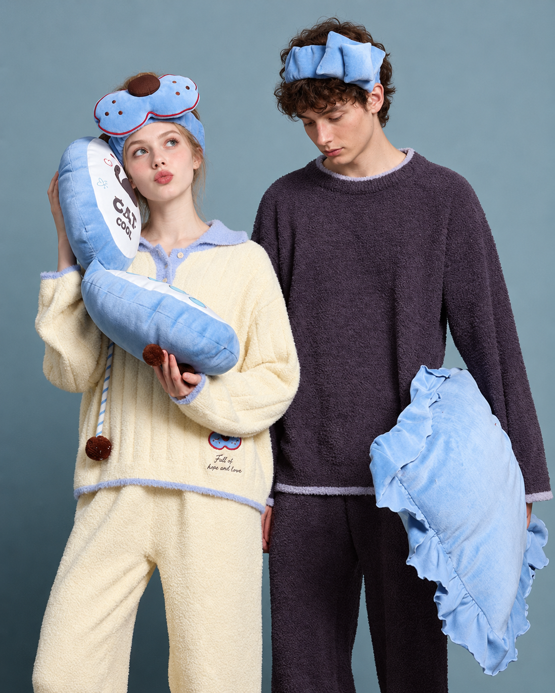 Cat Motif Fleece Pajama Set - standing view holding blue cushions - Roomden