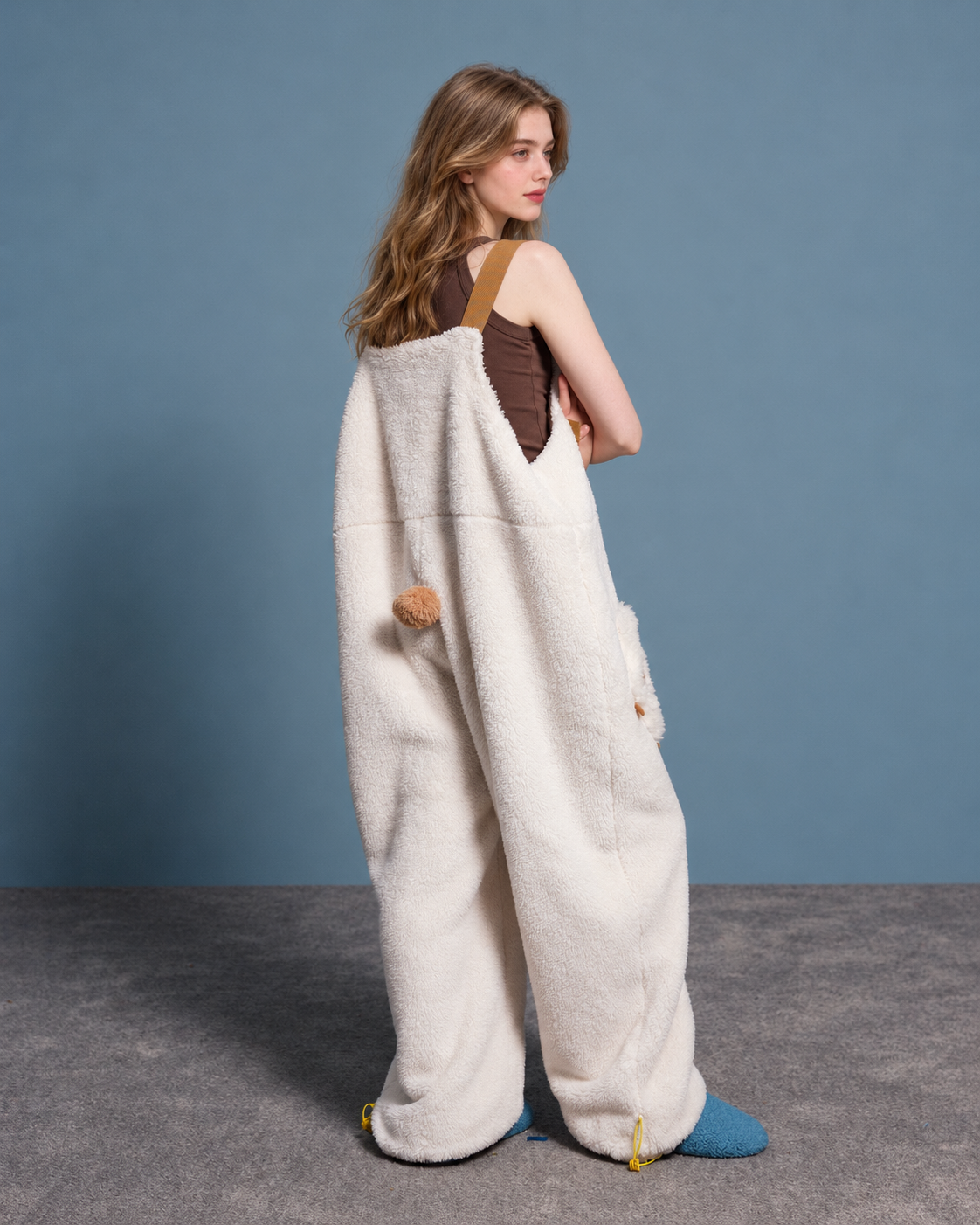 Cat-paw plush one-piece pajamas – cream back view with pompom tail - Roomden
