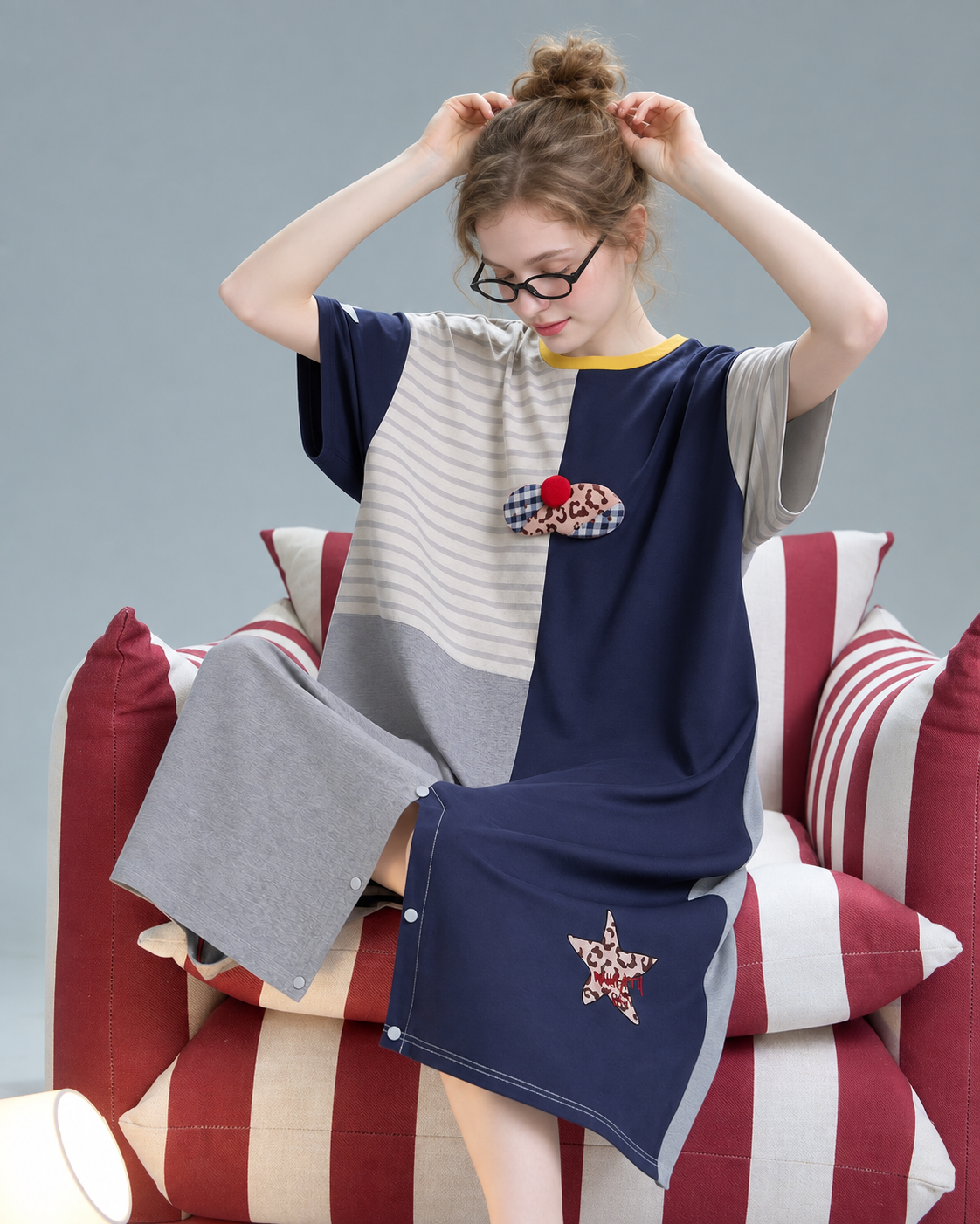 Gray and navy patchwork pajamas – seated view with cat and star appliques - Roomden