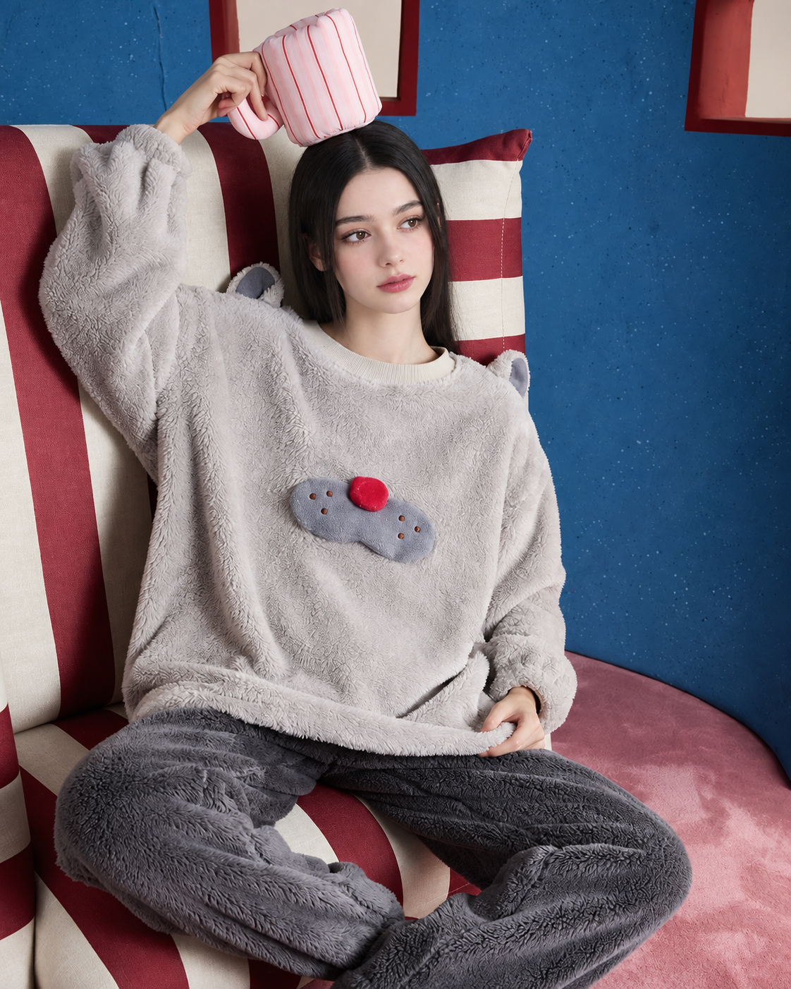 Cat-Ear Fleece Pajama Set – gray pullover and charcoal pants in a seated front view - Roomden