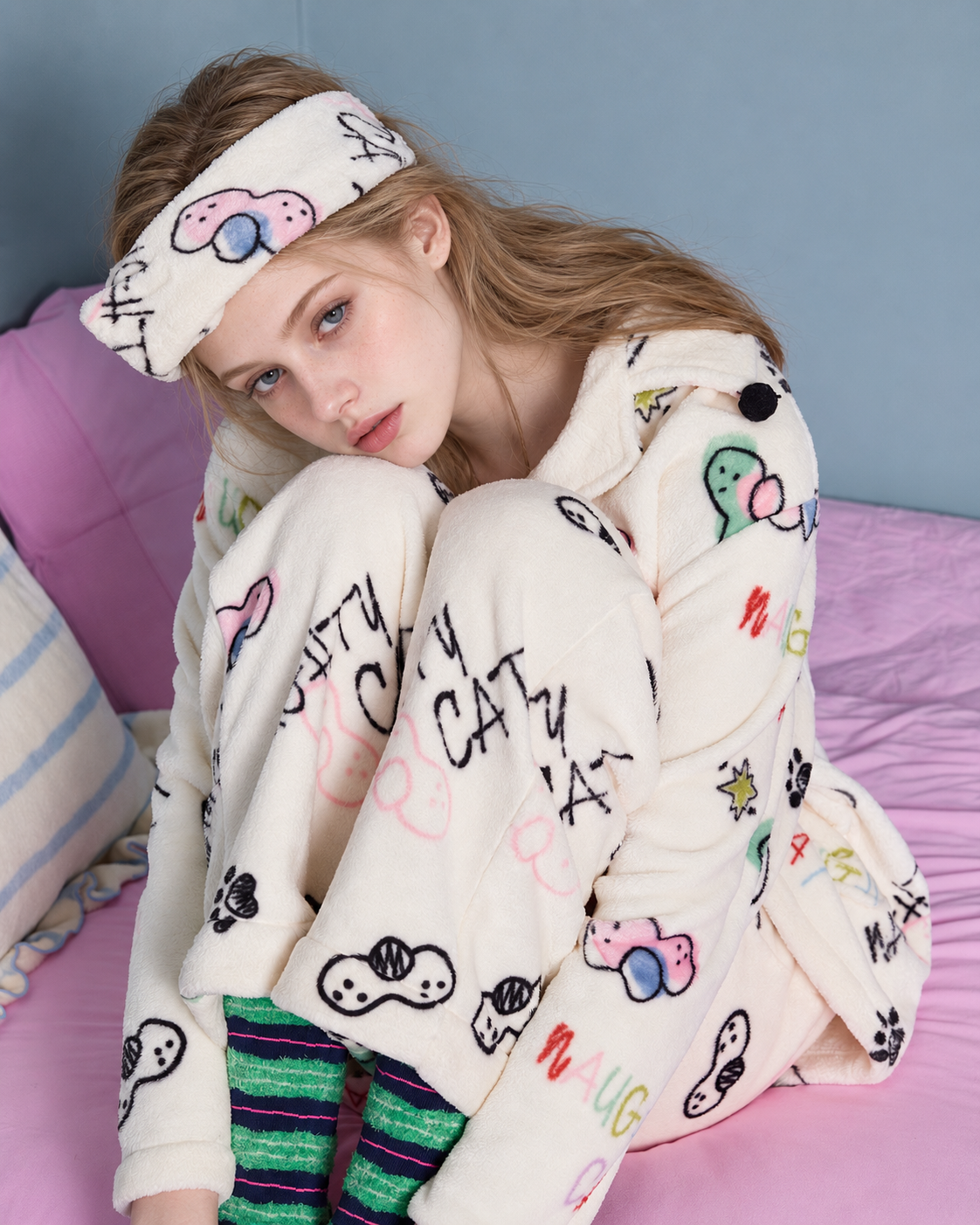 Doodlewhisk Cat Doodle Fleece Pajama Set – cream pajama set, knees-up seated view - Roomden