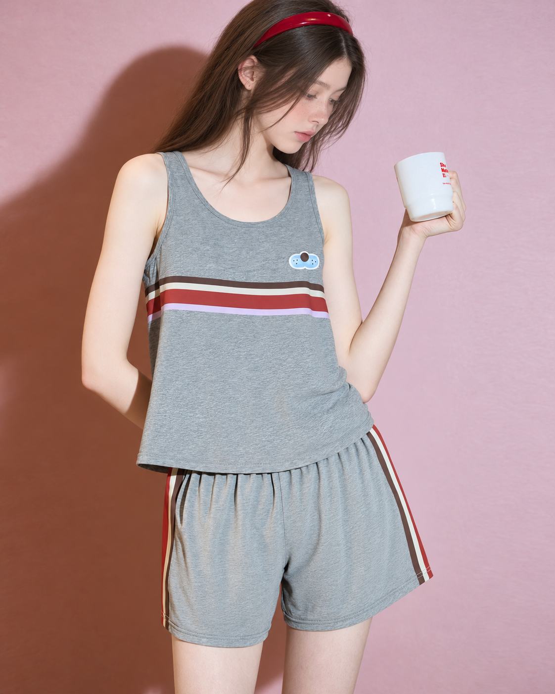 Front view of the scoop-neck tank and elastic-waist shorts