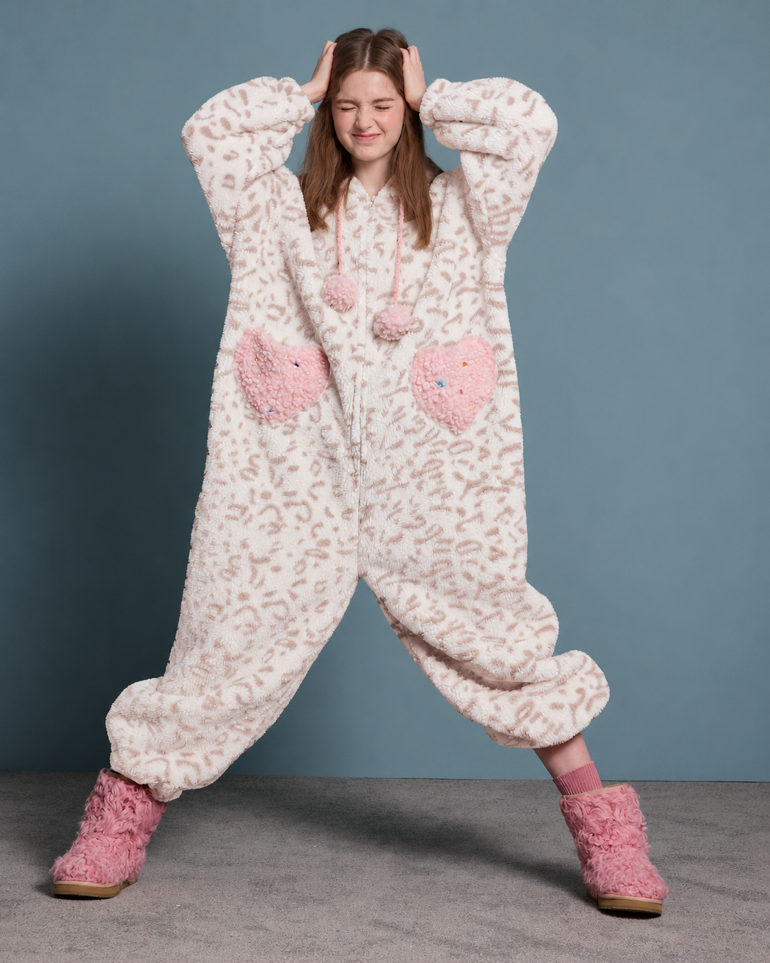 Cat-Ear Leopard Fleece One-Piece Pajamas – cream and pink front view in a wide playful stance - Roomden