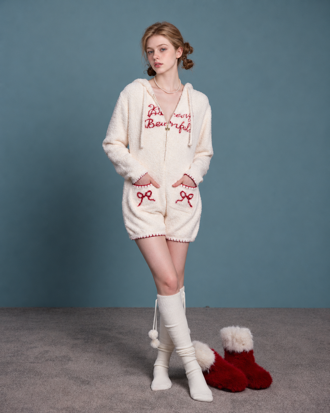 Rabbit-Ear Fleece Onesie – cream front view with bow pockets - Roomden